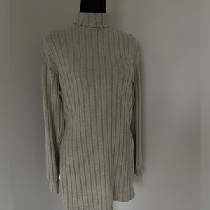 Selling this Turtle Neck drop Shoulder Slit shirt! Never worn, brand new!